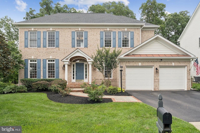 18416 Mill Run Ct, Leesburg, VA 20176 - view of front of home featuring asphalt driveway, a front yard, a garage, and brick siding