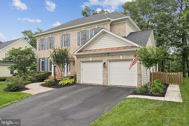18416 Mill Run Ct, Leesburg, VA 20176 - view of front of home featuring brick siding, an attached garage, asphalt driveway, and a standing seam roof