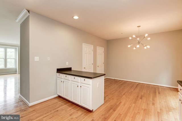 7041 Water Oak Rd Unit 42, Elkridge, MD 21075 - kitchen featuring a peninsula, a chandelier, dark countertops, light wood-style flooring, and recessed lighting