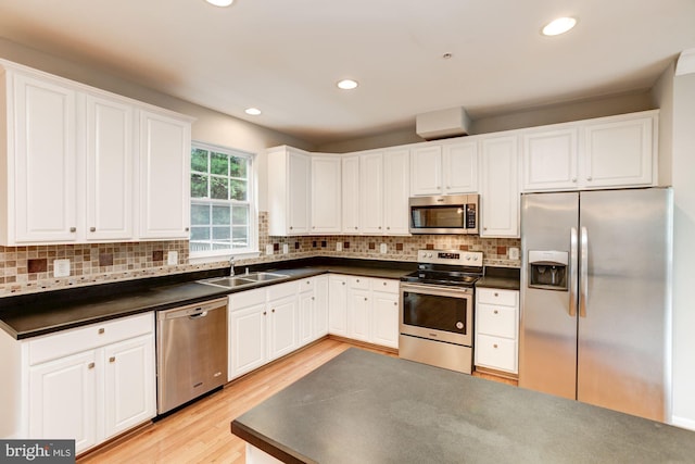 7041 Water Oak Rd Unit 42, Elkridge, MD 21075 - kitchen featuring stainless steel appliances, dark countertops, white cabinetry, and recessed lighting