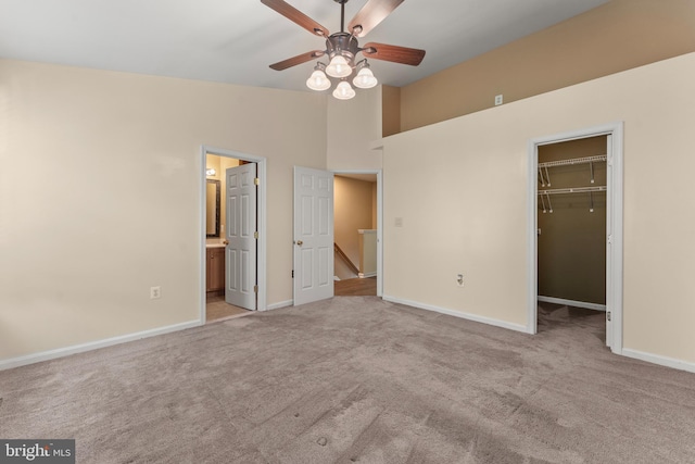 5522 Trout Run Rd, Clinton, MD 20735 - unfurnished bedroom with carpet flooring, a walk in closet, a closet, ensuite bathroom, and a towering ceiling