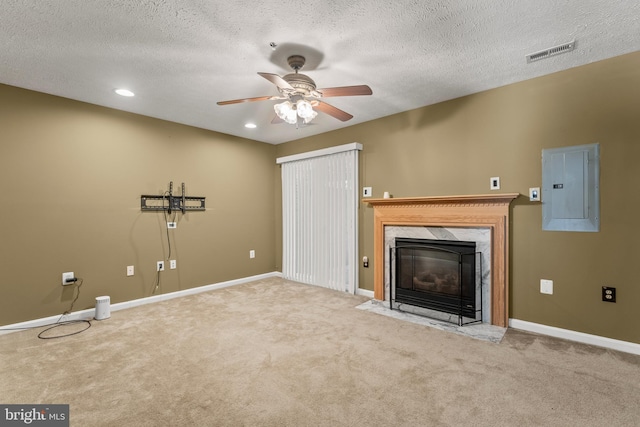 5522 Trout Run Rd, Clinton, MD 20735 - unfurnished living room featuring electric panel, a ceiling fan, a premium fireplace, carpet floors, and a textured ceiling