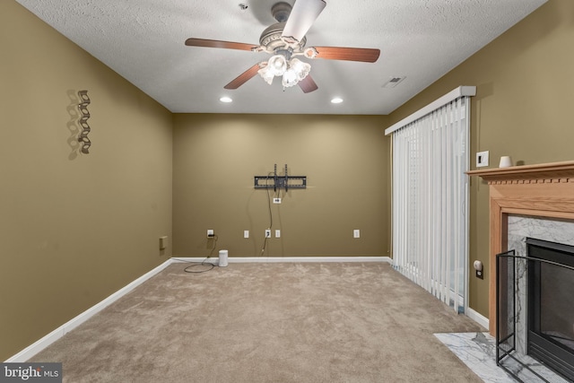5522 Trout Run Rd, Clinton, MD 20735 - laundry room featuring ceiling fan, carpet, a premium fireplace, a textured ceiling, and recessed lighting