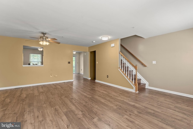5522 Trout Run Rd, Clinton, MD 20735 - unfurnished living room featuring wood finished floors, stairs, and ceiling fan