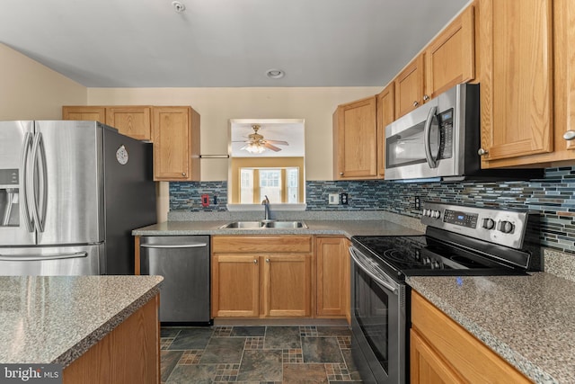 5522 Trout Run Rd, Clinton, MD 20735 - kitchen featuring appliances with stainless steel finishes, decorative backsplash, ceiling fan, and dark stone finish flooring