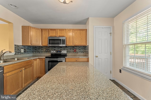 5522 Trout Run Rd, Clinton, MD 20735 - kitchen with stainless steel appliances, tasteful backsplash, and light stone counters