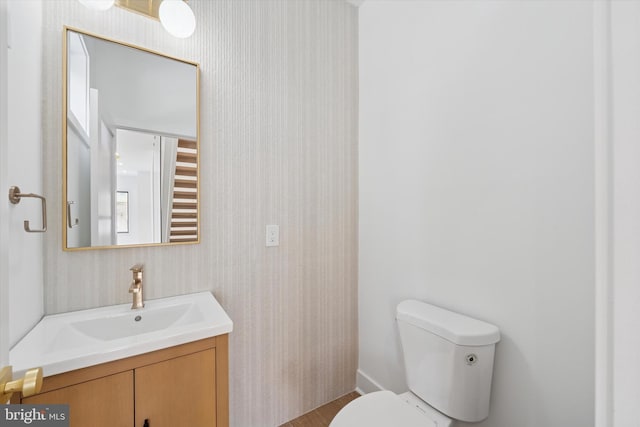 919 S 11th St Unit B, Philadelphia, PA 19147 - half bathroom with vanity, wallpapered walls, and wood finished floors