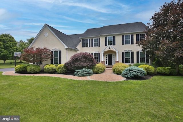 2553 Stone Hill Rd, Harleysville, PA 19438 - colonial-style house with a front yard and stucco siding