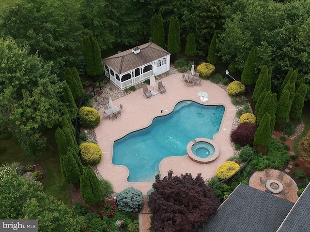 2553 Stone Hill Rd, Harleysville, PA 19438 - view of pool with a storage structure, an outdoor structure, a patio area, a pool with connected hot tub, and outdoor dining space