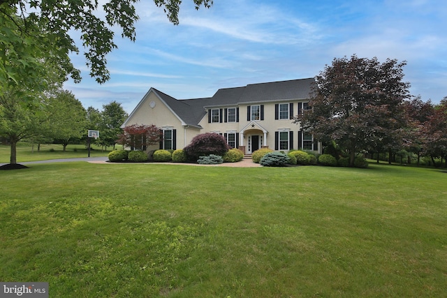 2553 Stone Hill Rd, Harleysville, PA 19438 - colonial-style house with a front lawn and stucco siding