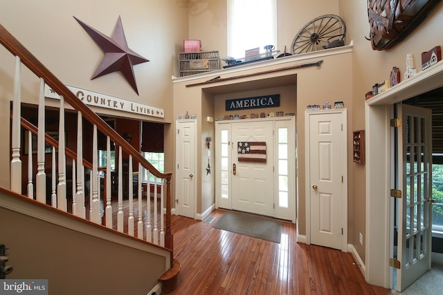 2553 Stone Hill Rd, Harleysville, PA 19438 - foyer entrance featuring a high ceiling, wood finished floors, and stairway