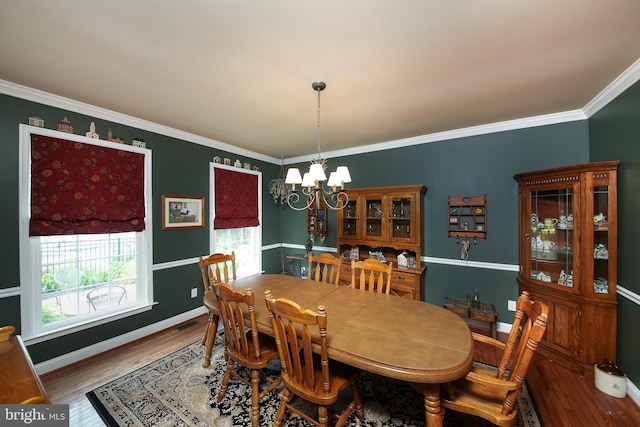 2553 Stone Hill Rd, Harleysville, PA 19438 - dining space featuring a chandelier, wood finished floors, and ornamental molding