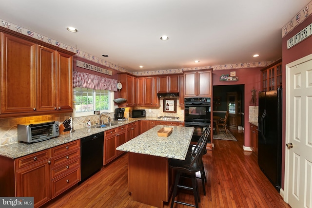 2553 Stone Hill Rd, Harleysville, PA 19438 - kitchen featuring black appliances, a kitchen island, backsplash, recessed lighting, and dark wood-style floors