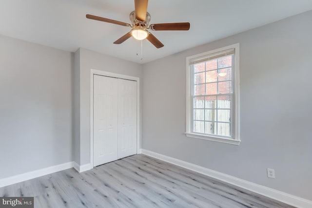 537 Newcomb St SE, Washington, DC 20032 - unfurnished bedroom featuring light wood-type flooring, a closet, and a ceiling fan