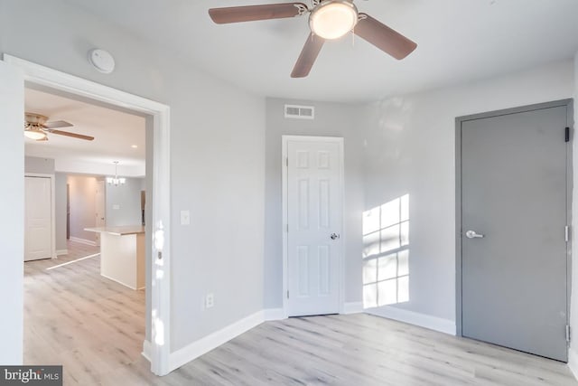 537 Newcomb St SE, Washington, DC 20032 - unfurnished bedroom with light wood finished floors and a ceiling fan