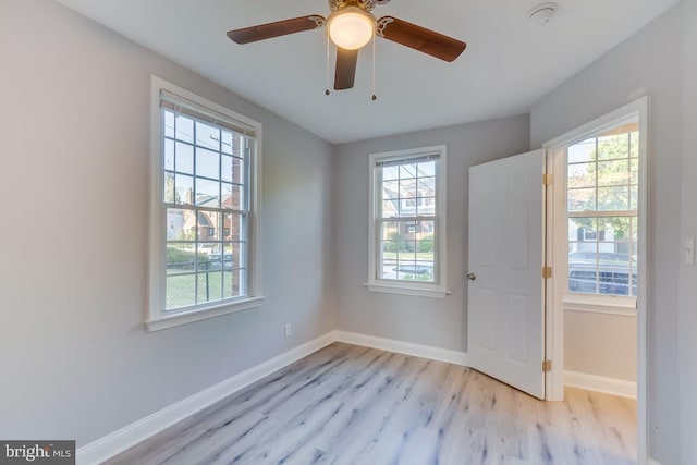 537 Newcomb St SE, Washington, DC 20032 - unfurnished room with light wood-style floors, a smoke detector, and a ceiling fan