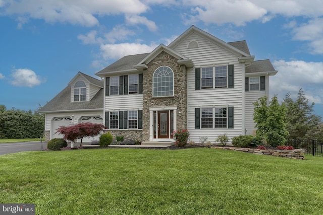 395 Olde Meadow Ln, Lebanon, PA 17042 - view of front of property with stone siding, an attached garage, driveway, and a shingled roof