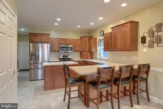395 Olde Meadow Ln, Lebanon, PA 17042 - kitchen featuring appliances with stainless steel finishes, a peninsula, ornamental molding, light countertops, and brown cabinetry