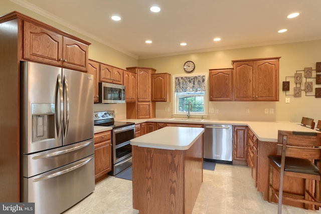 395 Olde Meadow Ln, Lebanon, PA 17042 - kitchen with appliances with stainless steel finishes, a center island, recessed lighting, ornamental molding, and light countertops