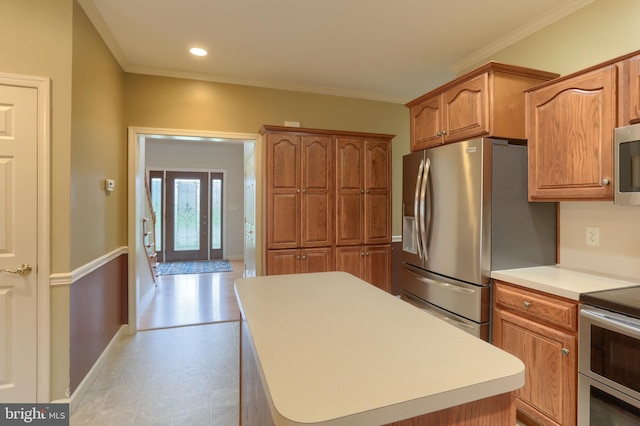 395 Olde Meadow Ln, Lebanon, PA 17042 - kitchen with stainless steel appliances, light countertops, light floors, ornamental molding, and a center island