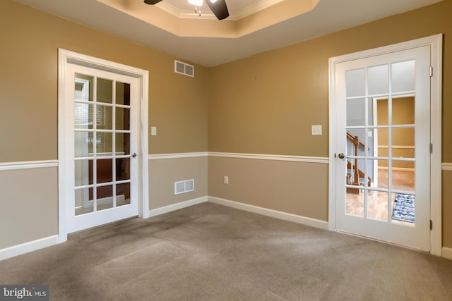 395 Olde Meadow Ln, Lebanon, PA 17042 - spare room featuring carpet floors, a ceiling fan, a tray ceiling, and crown molding