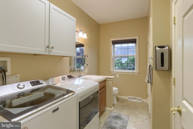 395 Olde Meadow Ln, Lebanon, PA 17042 - laundry room with washing machine and clothes dryer and light tile patterned floors