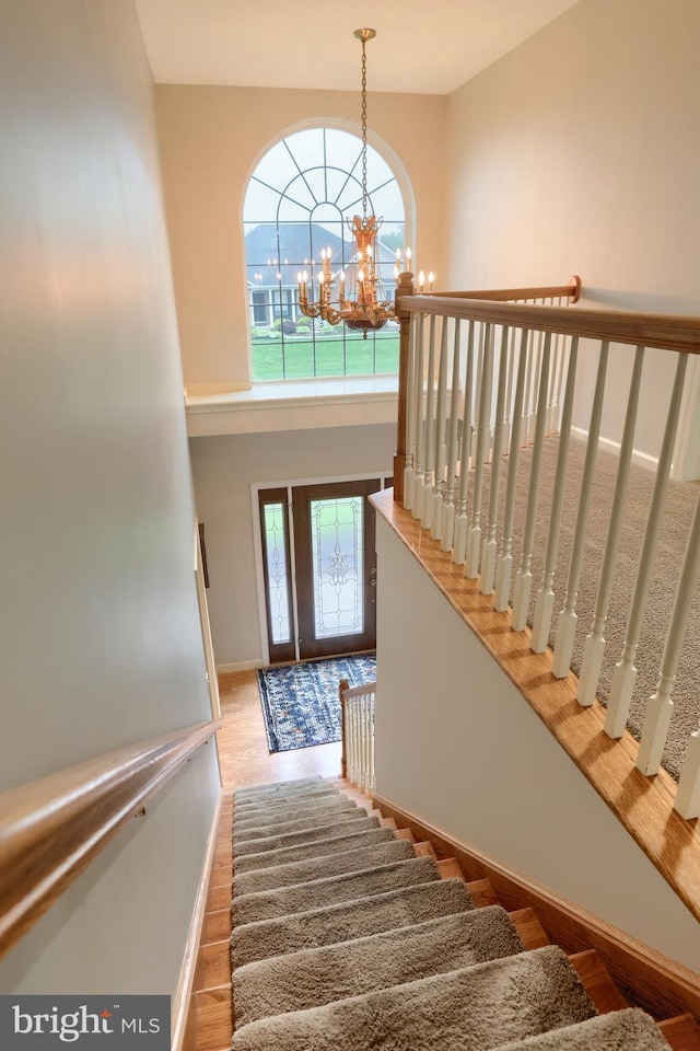 395 Olde Meadow Ln, Lebanon, PA 17042 - stairs with a chandelier, wood finished floors, and a towering ceiling