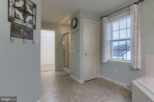 395 Olde Meadow Ln, Lebanon, PA 17042 - full bathroom featuring a garden tub, a shower stall, and a walk in closet