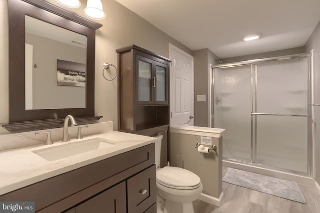 395 Olde Meadow Ln, Lebanon, PA 17042 - bathroom featuring a shower stall, vanity, and wood finished floors