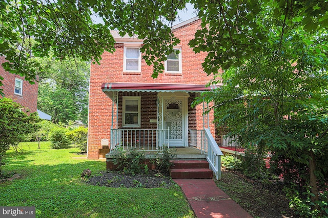 6203 Hopeton Ave, Baltimore, MD 21215 - view of front of house featuring brick siding and a front yard
