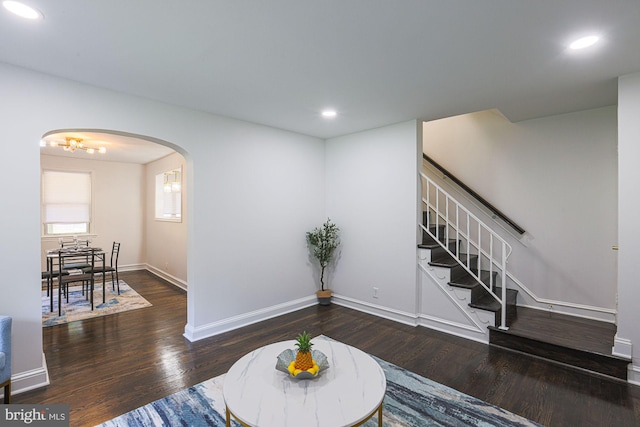 6203 Hopeton Ave, Baltimore, MD 21215 - living room featuring arched walkways, wood finished floors, recessed lighting, and stairway