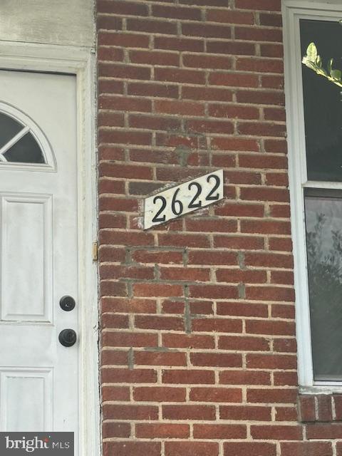 2622 W Franklin St, Baltimore, MD 21223 - view of exterior entry featuring brick siding