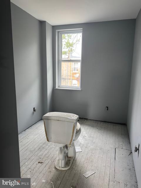 2622 W Franklin St, Baltimore, MD 21223 - bathroom featuring hardwood / wood-style flooring and toilet