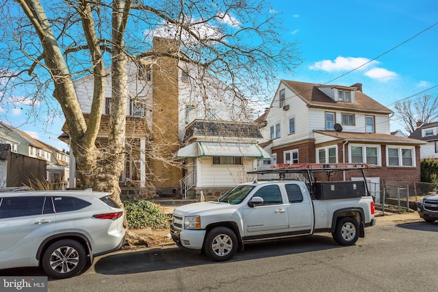 512 Fairfield Ave, Upper Darby, PA 19082 - view of front of house featuring brick siding and a chimney