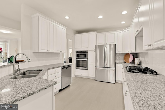 22974 Weybridge Sq, Broadlands, VA 20148 - kitchen featuring stainless steel appliances, white cabinetry, tasteful backsplash, and recessed lighting