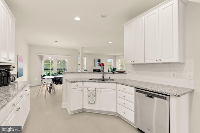 22974 Weybridge Sq, Broadlands, VA 20148 - kitchen with stainless steel dishwasher, plenty of natural light, white cabinetry, and recessed lighting