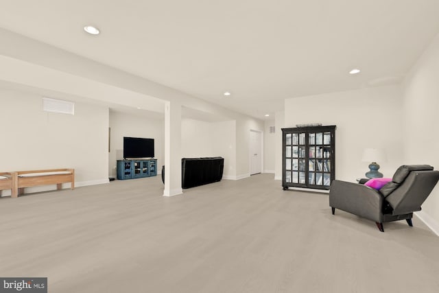 22974 Weybridge Sq, Broadlands, VA 20148 - sitting room with light wood finished floors and recessed lighting