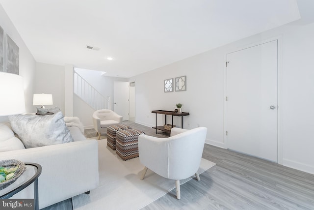 10909 Knights Bridge Ct, Reston, VA 20190 - living area with stairs, light wood finished floors, and recessed lighting