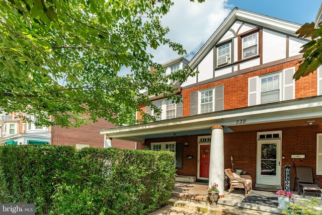 227 Ruby St, Lancaster, PA 17603 - townhome / multi-family property featuring a porch, brick siding, and stucco siding