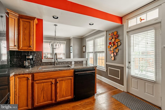 227 Ruby St, Lancaster, PA 17603 - kitchen with black dishwasher, brown cabinets, crown molding, dark wood-type flooring, and dark countertops