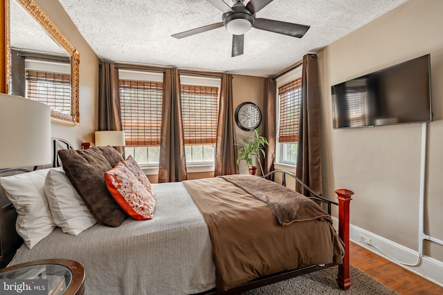 227 Ruby St, Lancaster, PA 17603 - bedroom featuring wood finished floors, a textured ceiling, and ceiling fan