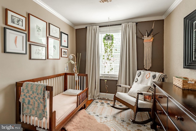 227 Ruby St, Lancaster, PA 17603 - bedroom with ornamental molding, wood finished floors, and a crib