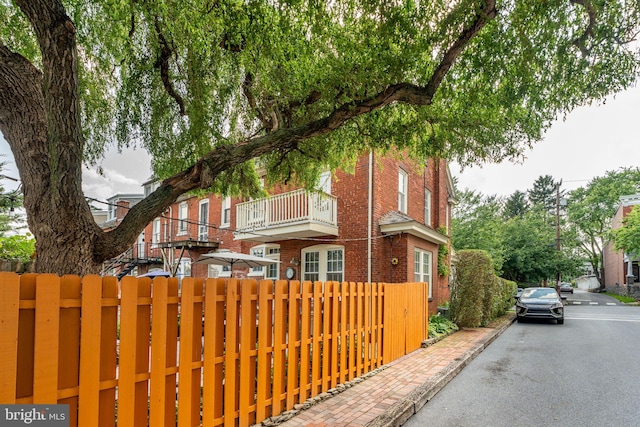 227 Ruby St, Lancaster, PA 17603 - view of front facade with brick siding and a balcony