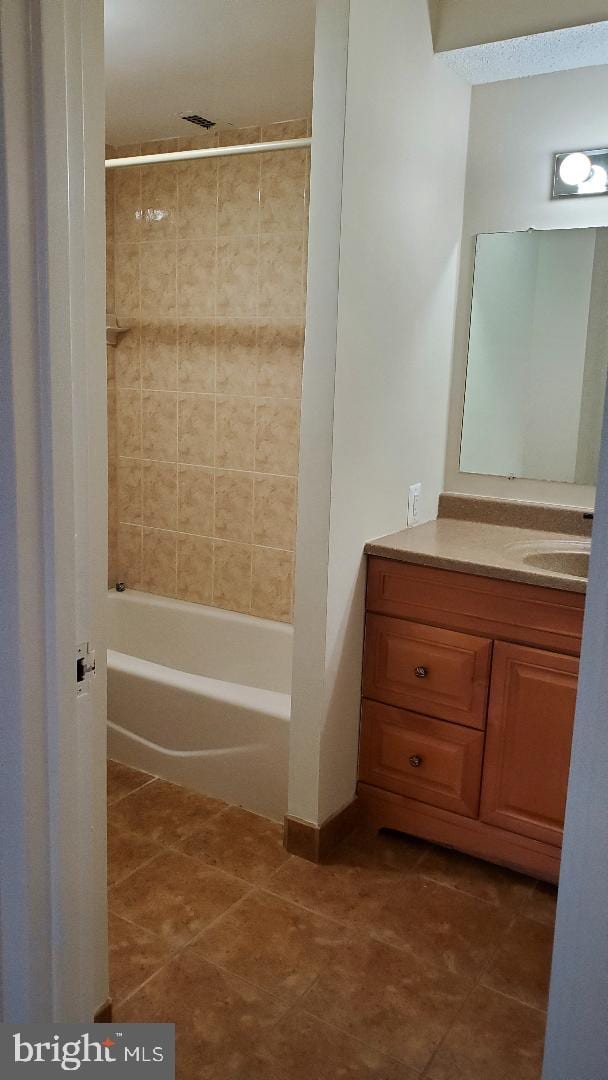 3705 S George Mason Dr Unit 1311, Falls Church, VA 22041 - bathroom with vanity, tile patterned floors, and bathtub / shower combination