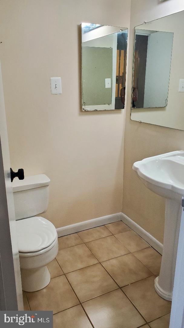3705 S George Mason Dr Unit 1311, Falls Church, VA 22041 - half bathroom with toilet and tile patterned flooring