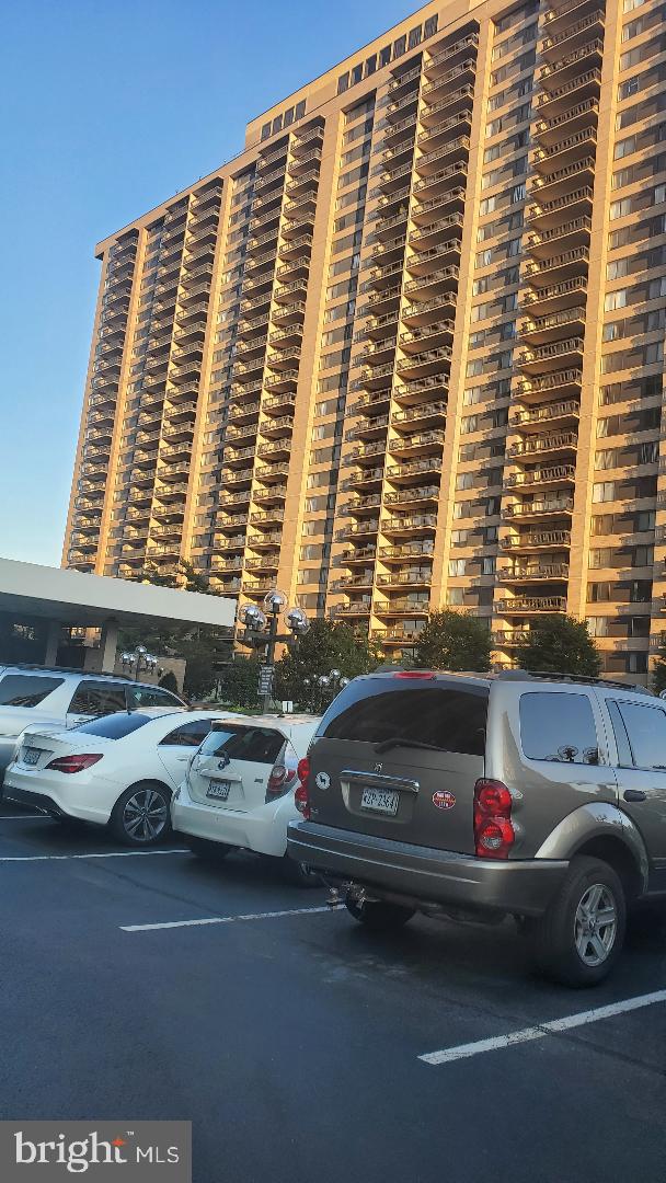 3705 S George Mason Dr Unit 1311, Falls Church, VA 22041 - view of apartment building / complex with uncovered parking