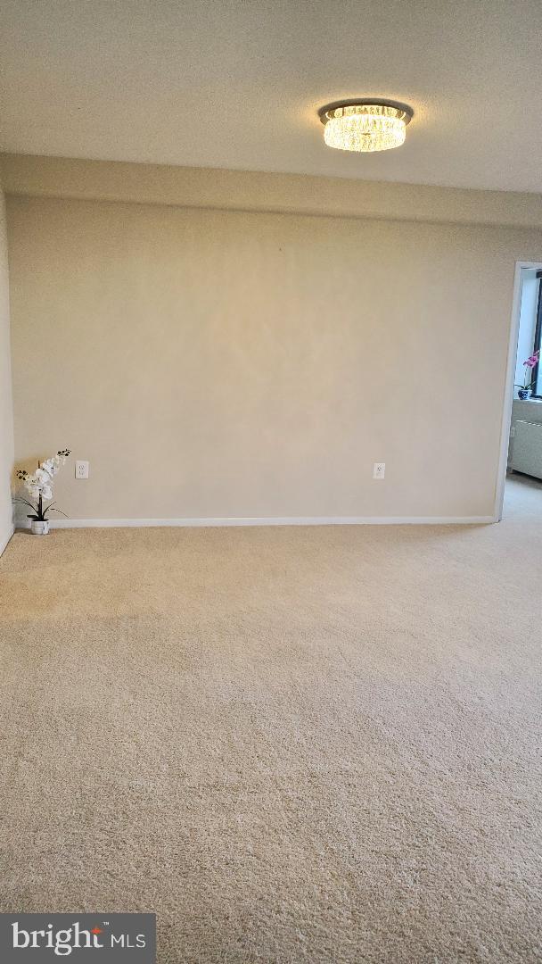 3705 S George Mason Dr Unit 1311, Falls Church, VA 22041 - empty room with carpet flooring and baseboards