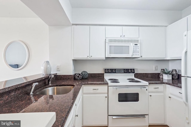 1401 17th St NW Unit 610, Washington, DC 20036 - kitchen featuring white appliances, white cabinets, and dark stone counters
