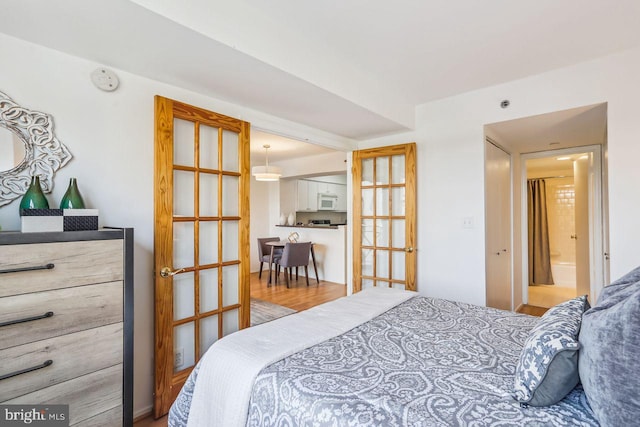 1401 17th St NW Unit 610, Washington, DC 20036 - bedroom with wood finished floors