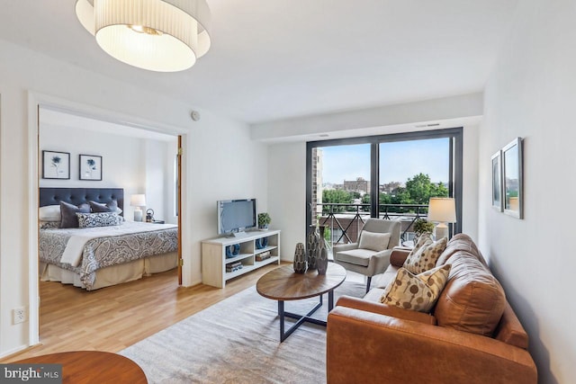 1401 17th St NW Unit 610, Washington, DC 20036 - bedroom featuring access to exterior and wood finished floors